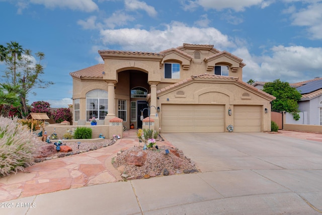 5940 W Robinson Way, Chandler, AZ 85226 - mediterranean / spanish house with stucco siding, a garage, driveway, and a tiled roof