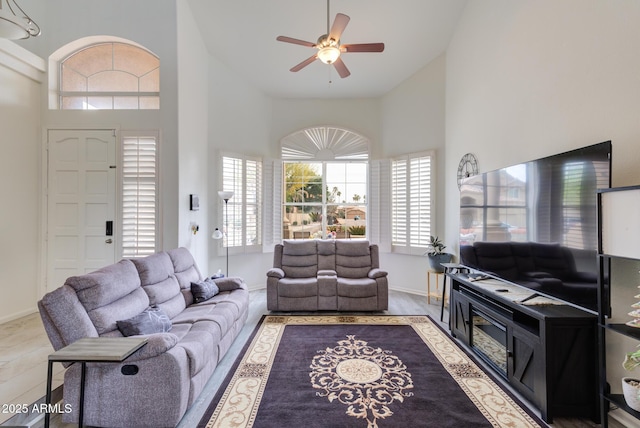 5940 W Robinson Way, Chandler, AZ 85226 - living room featuring high vaulted ceiling, a ceiling fan, and baseboards