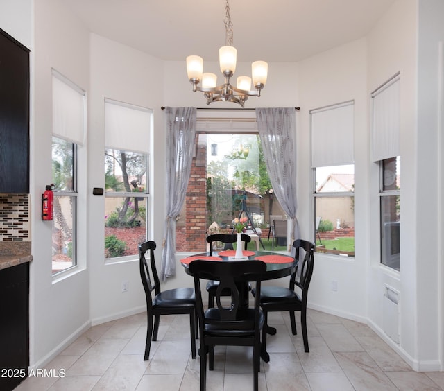 5940 W Robinson Way, Chandler, AZ 85226 - dining space with a chandelier, plenty of natural light, and baseboards
