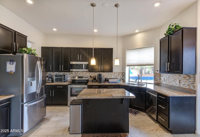 5940 W Robinson Way, Chandler, AZ 85226 - kitchen featuring stainless steel appliances, a sink, light stone counters, backsplash, and recessed lighting