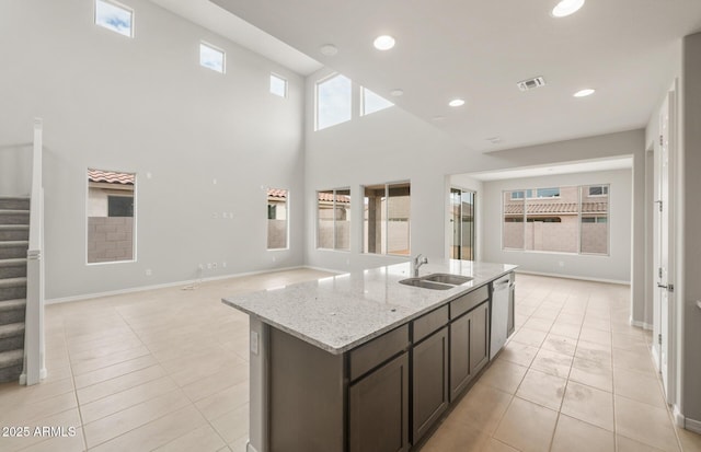 17633 W Palo Verde Dr, Litchfield Park, AZ 85340 - kitchen featuring open floor plan, dishwasher, light stone counters, an island with sink, and recessed lighting
