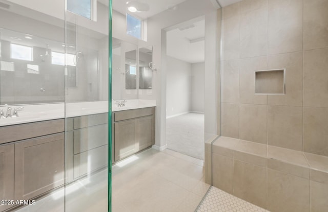17633 W Palo Verde Dr, Litchfield Park, AZ 85340 - full bathroom featuring double vanity, a tile shower, and tile patterned flooring