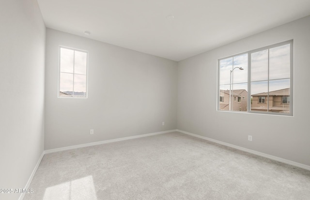 17633 W Palo Verde Dr, Litchfield Park, AZ 85340 - carpeted empty room with healthy amount of natural light