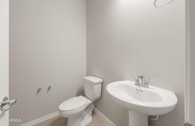 17633 W Palo Verde Dr, Litchfield Park, AZ 85340 - half bathroom featuring toilet and tile patterned floors