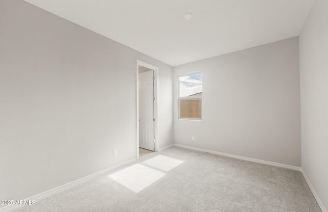 17633 W Palo Verde Dr, Litchfield Park, AZ 85340 - unfurnished room featuring light colored carpet and baseboards