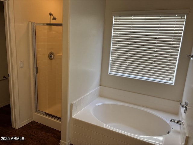 full bathroom with a garden tub and a shower stall