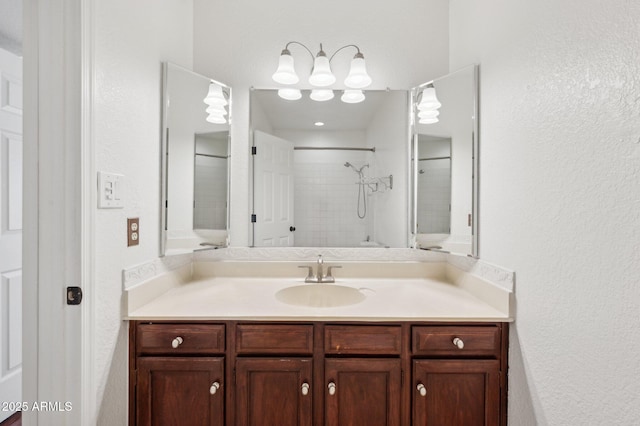 bathroom featuring vanity and a shower