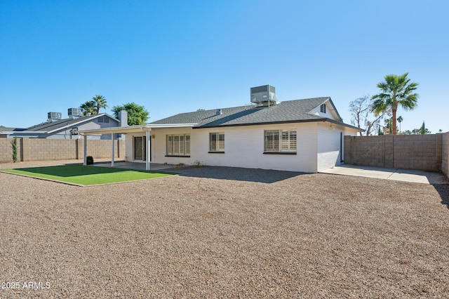 rear view of house featuring cooling unit and a patio