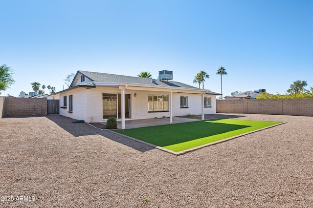 rear view of property featuring central air condition unit and a patio area