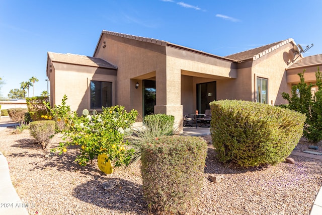 view of front of house with a patio area