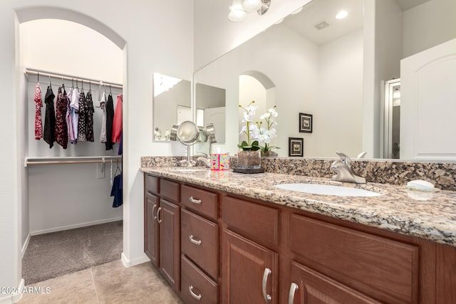 bathroom featuring tile patterned floors and vanity