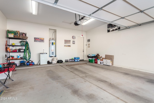 garage with water heater and a garage door opener