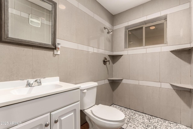 8542 N 30th Dr, Phoenix, AZ 85051 - bathroom with vanity, tile walls, toilet, and tiled shower