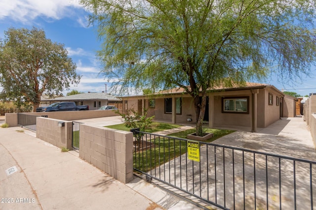 8542 N 30th Dr, Phoenix, AZ 85051 - ranch-style home featuring a fenced front yard, stucco siding, and a gate