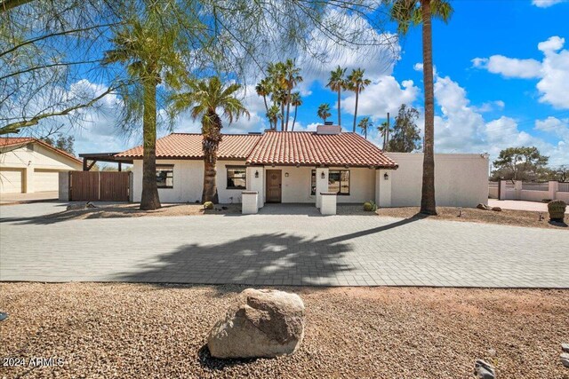 mediterranean / spanish house featuring a garage