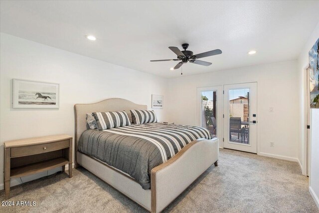 bedroom featuring light colored carpet, access to exterior, and ceiling fan