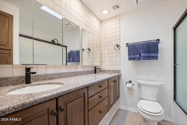 full bathroom with toilet, bath / shower combo with glass door, tile patterned floors, and vanity