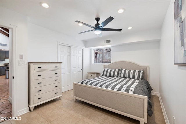 tiled bedroom featuring a closet and ceiling fan