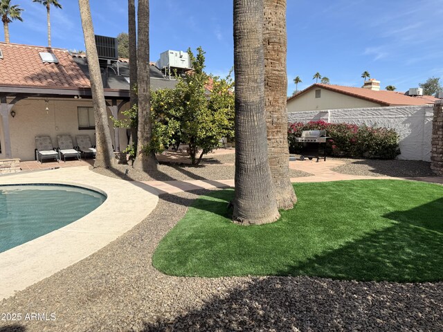 view of pool featuring a patio, french doors, and a diving board