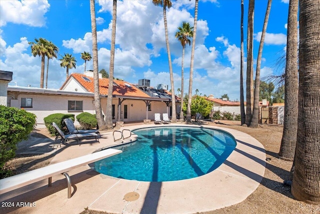 view of swimming pool with a patio area