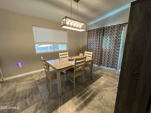 dining room with lofted ceiling