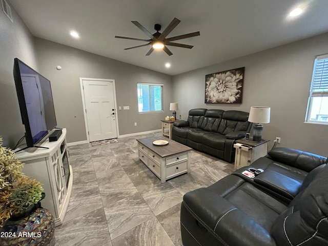 living room featuring vaulted ceiling and ceiling fan