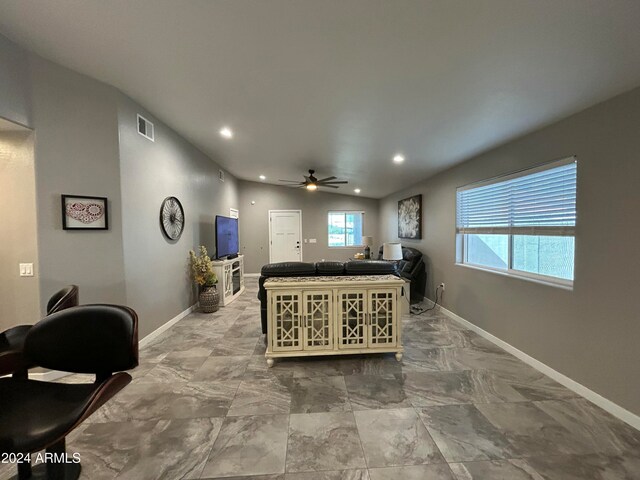 living room with vaulted ceiling and ceiling fan