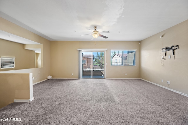 carpeted empty room with ceiling fan