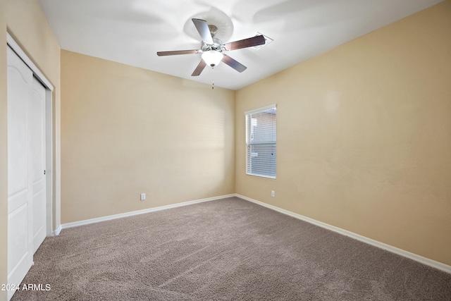 unfurnished bedroom with a closet, ceiling fan, and carpet floors