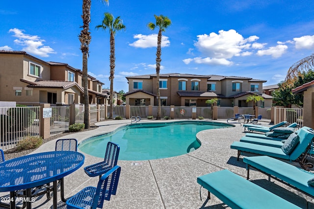 view of swimming pool with a patio area