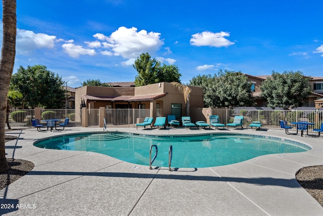 view of swimming pool with a patio