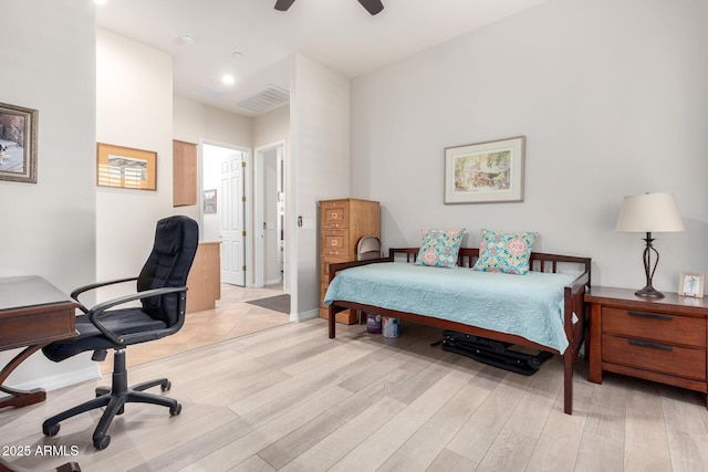 bedroom with light wood-type flooring and ceiling fan