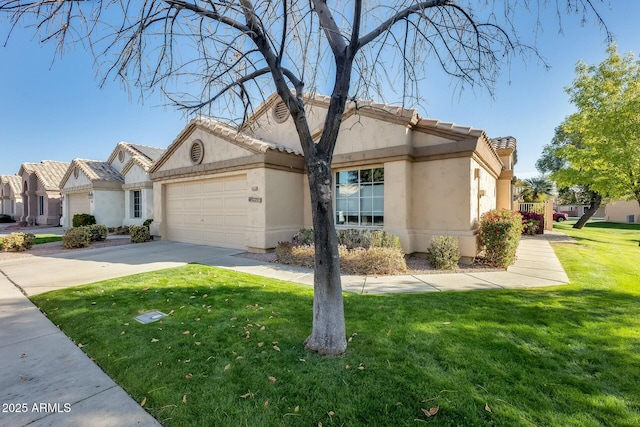 view of front of home featuring a front lawn and a garage