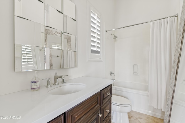 bathroom featuring tile patterned flooring, shower / tub combo, vanity, and toilet