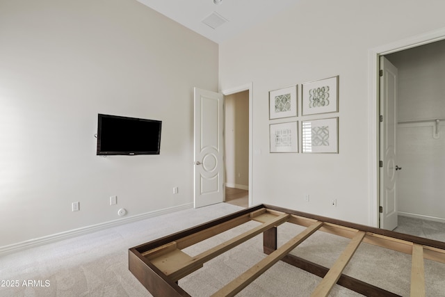 unfurnished bedroom featuring baseboards and carpet floors