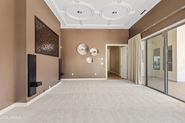 empty room featuring crown molding, a towering ceiling, carpet floors, coffered ceiling, and baseboards