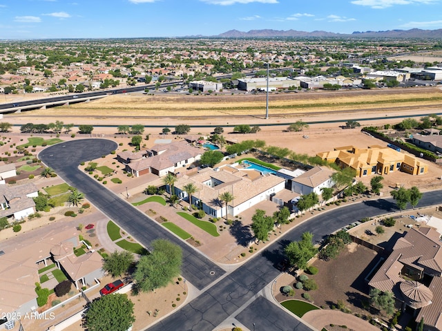 birds eye view of property featuring a mountain view and a residential view