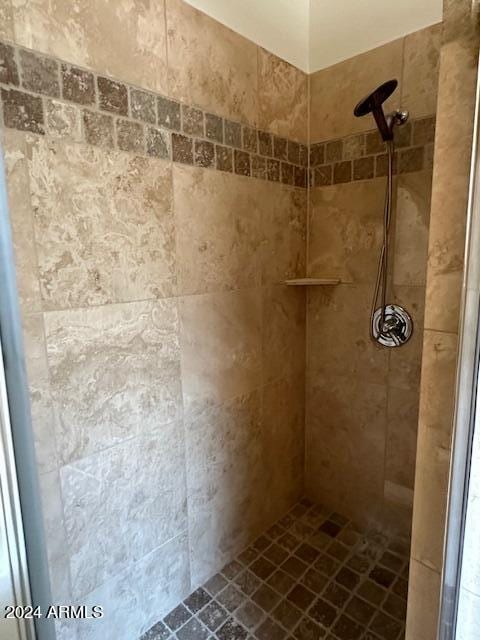 bathroom with tiled shower