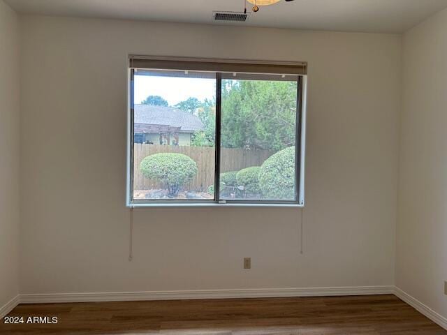 spare room with hardwood / wood-style flooring