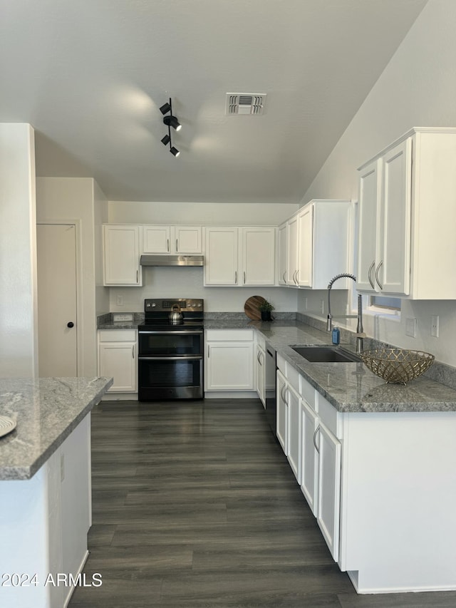 kitchen featuring white cabinets, electric range, and sink