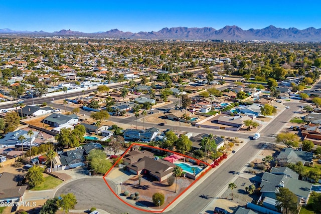 drone / aerial view featuring a mountain view