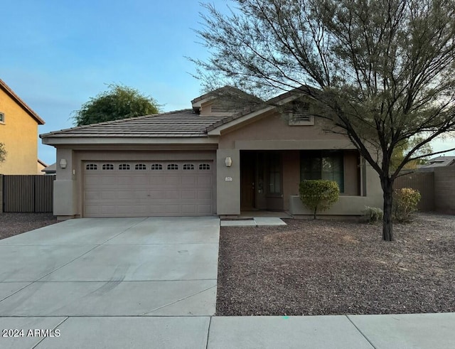 view of front of home with a garage