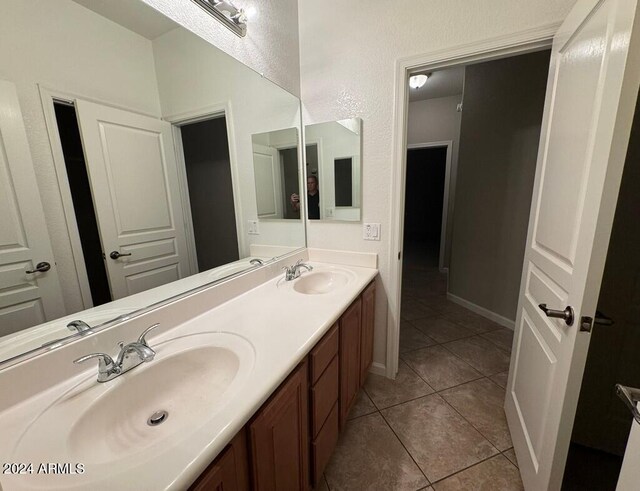 bathroom with tile patterned flooring and vanity