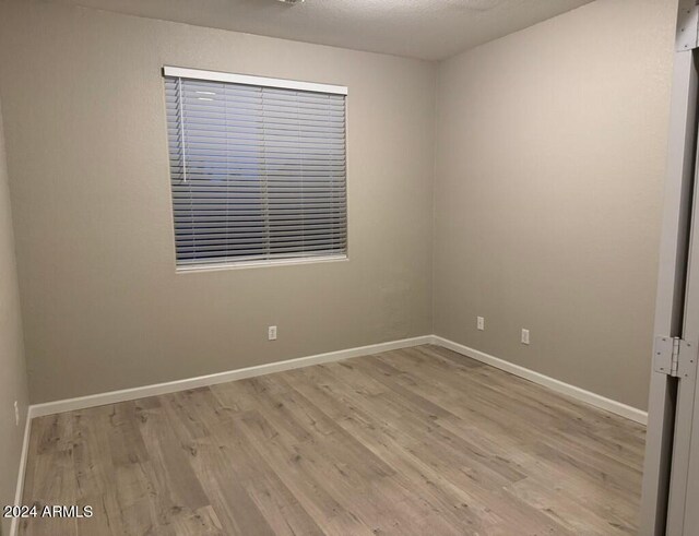 spare room featuring light hardwood / wood-style floors