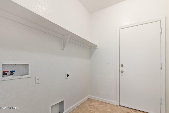 laundry area featuring hookup for a washing machine, light tile patterned flooring, and hookup for an electric dryer