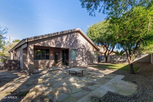 rear view of house with a patio area