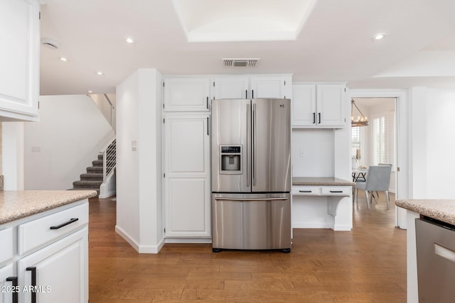 kitchen featuring recessed lighting, visible vents, white cabinetry, appliances with stainless steel finishes, and light wood-type flooring