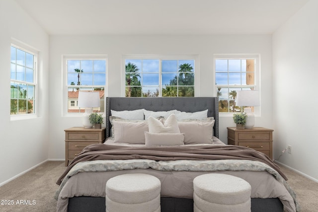 carpeted bedroom with baseboards