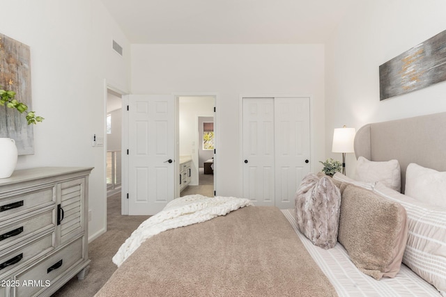 bedroom featuring a closet, carpet flooring, and a towering ceiling