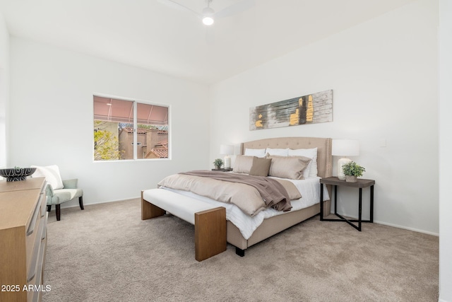 bedroom with light carpet, a ceiling fan, and baseboards